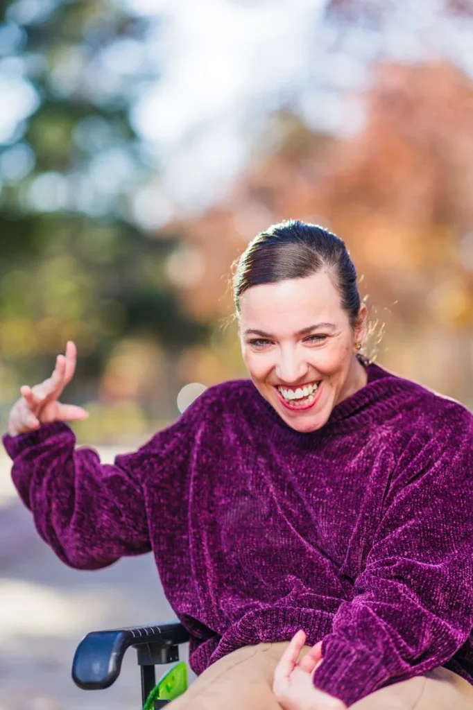 Disabled woman in wheelchair smiling