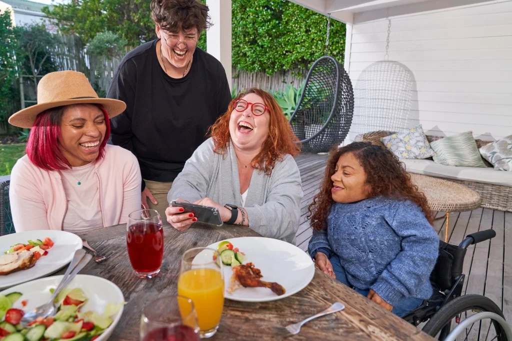 Diverse friends laughing outside