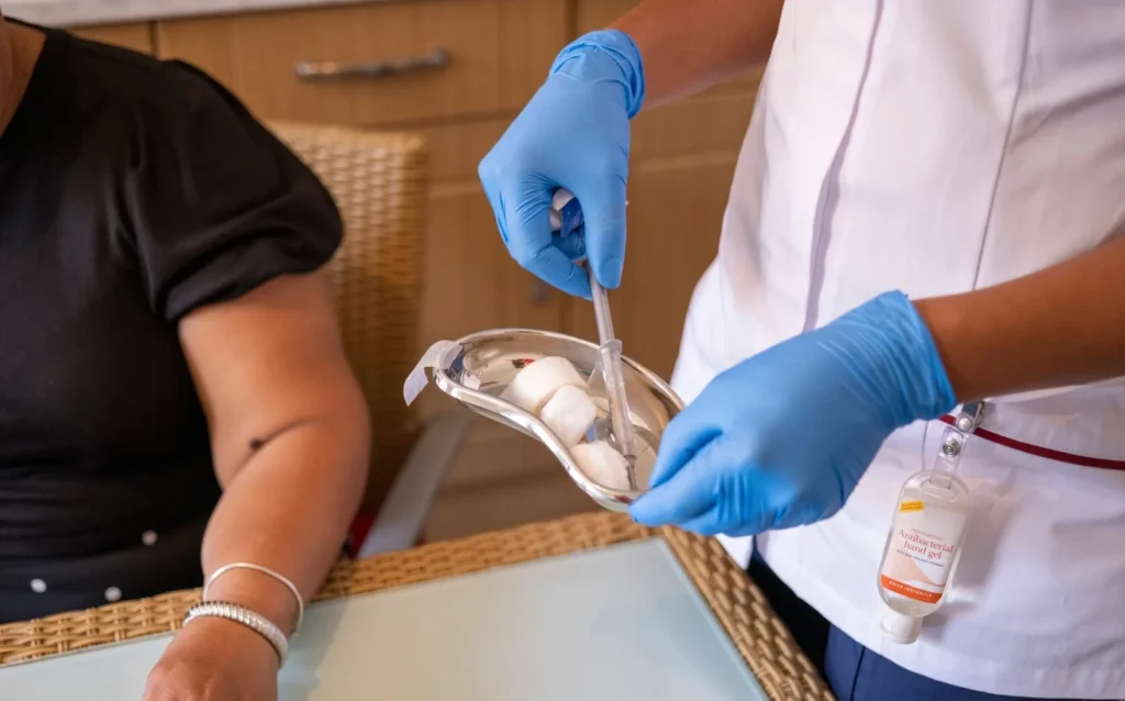 Close up of nurse holding injection at patients home